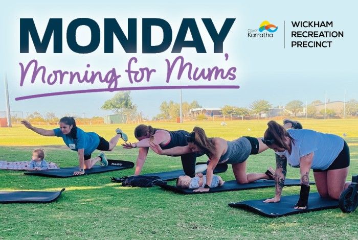 A promotional banner for "Monday Morning for Mums" at Wickham Recreation Precinct. The image shows a group of mums participating in an outdoor Mums & Bubs Pilates session on a grassy oval, with babies nearby on mats. Participants are performing Pilates exercises in a relaxed community setting under clear skies. The event title appears prominently at the top alongside the City of Karratha and Wickham Recreation Precinct logos.